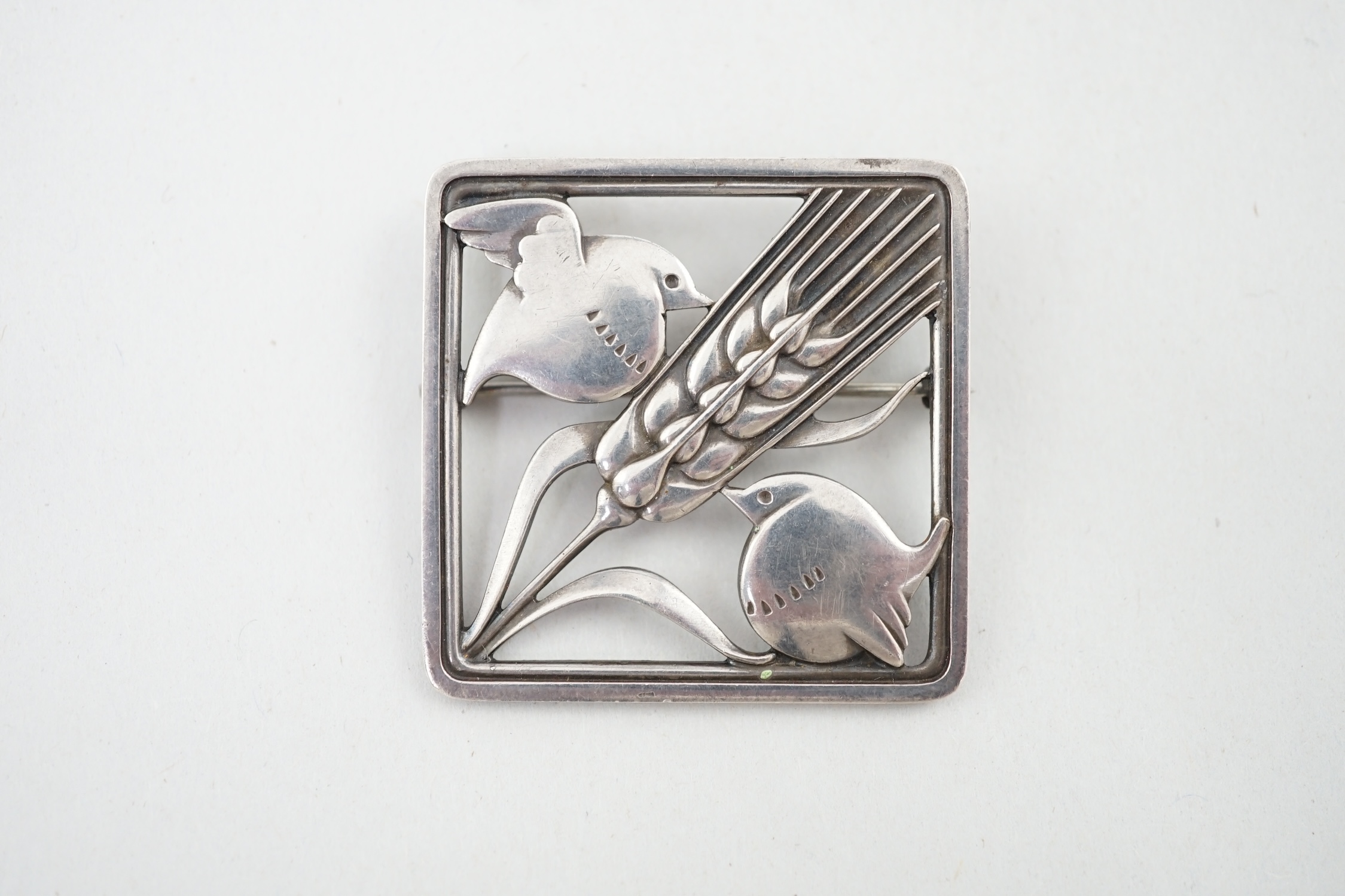 A Georg Jensen silver 'wheatsheaf and robin' brooch, design no. 250